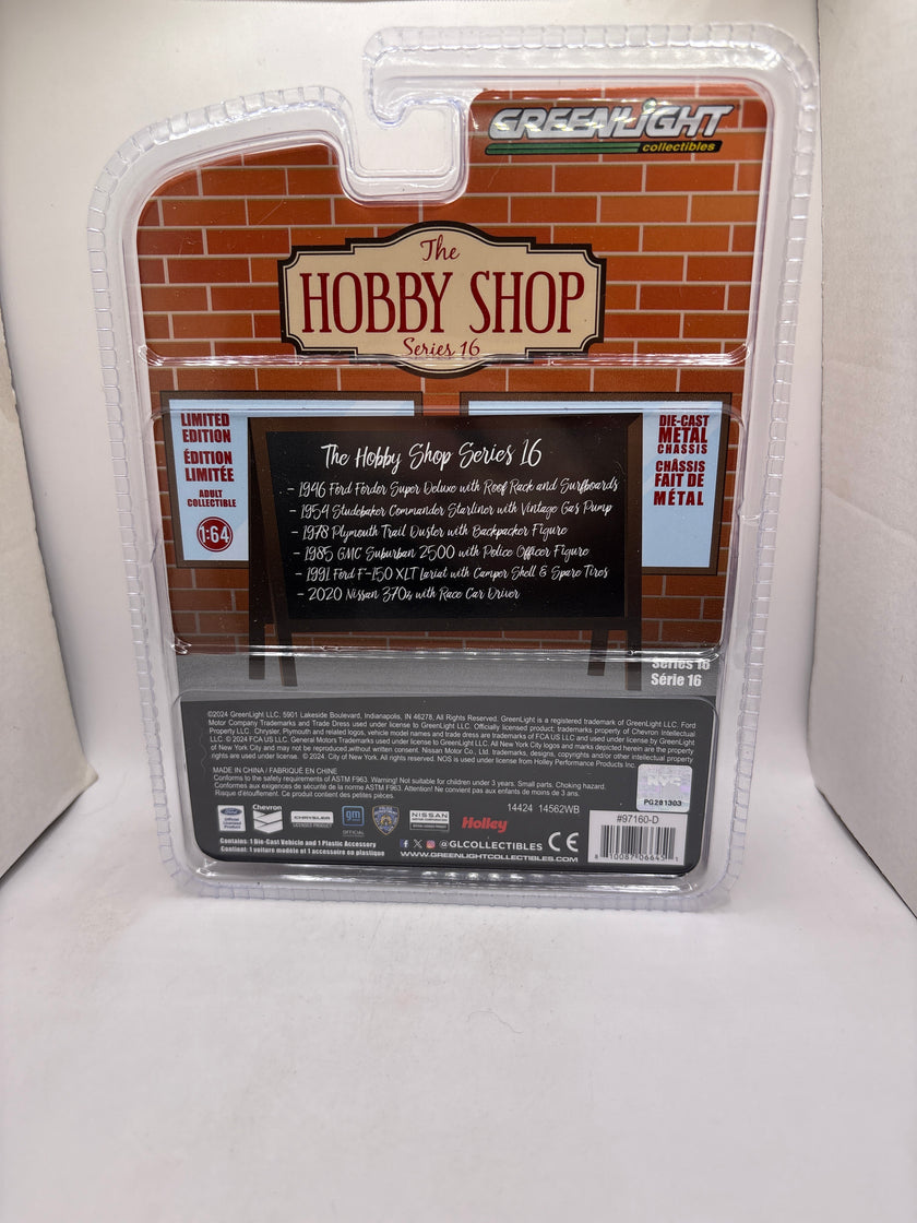 Greenlight 1985 GMC Suburban 2500 With Police Officer Figure Diecast