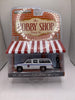 Greenlight 1985 GMC Suburban 2500 With Police Officer Figure Diecast
