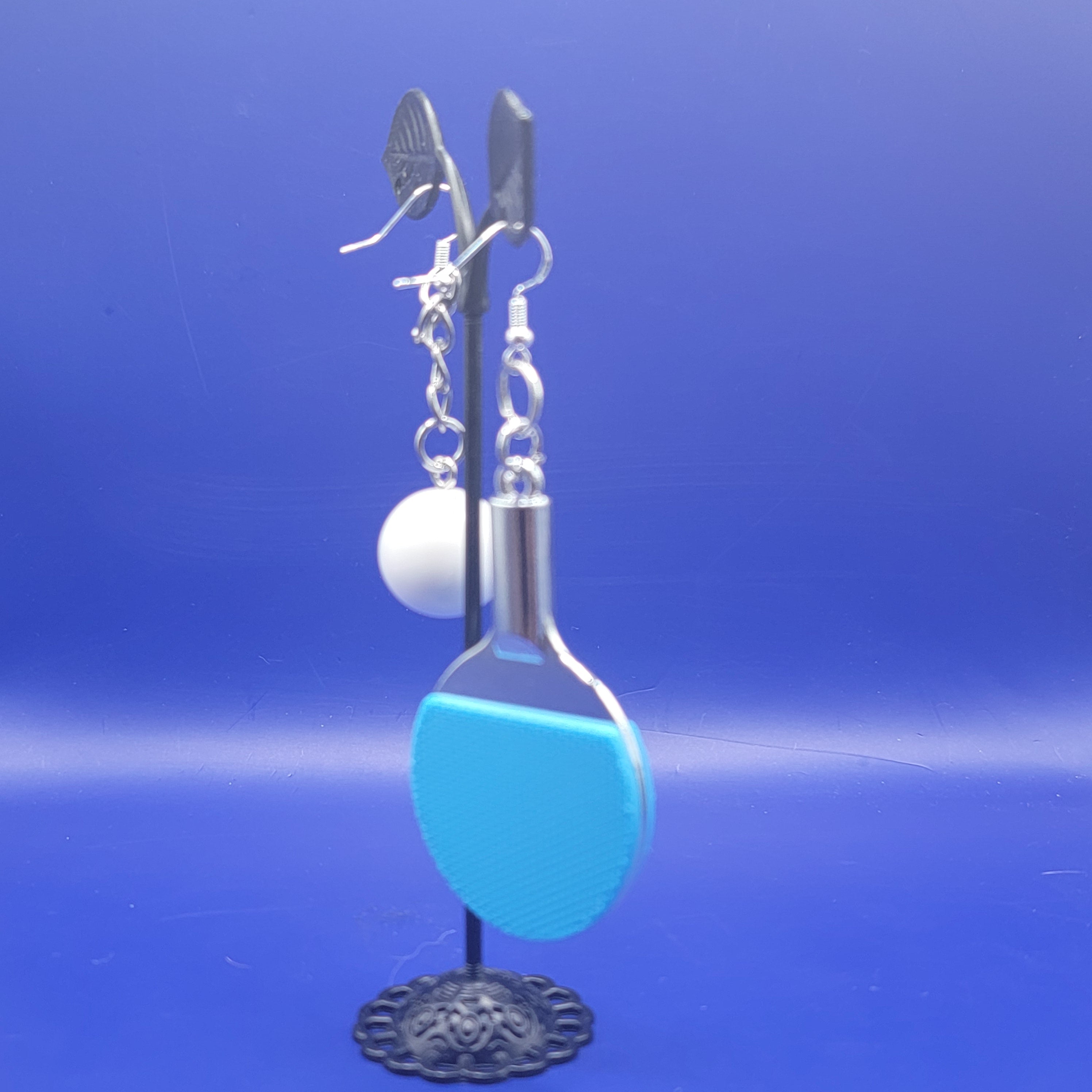 Blue ping pong paddle and ball earrings